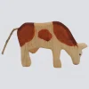 Holzwald Holzfigur Kuh fressend